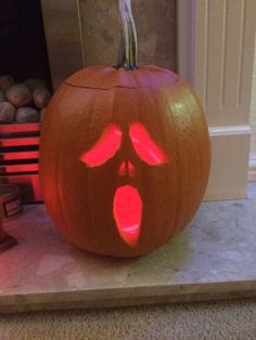 a carved pumpkin with an evil face on it