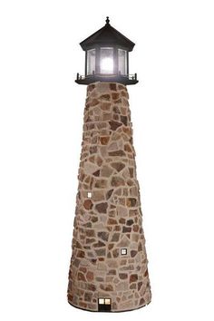 a stone lighthouse with a light on it's top is shown against a white background