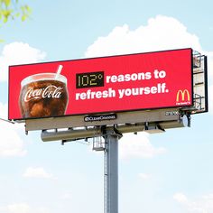 a billboard with a drink on it advertising mcdonald's