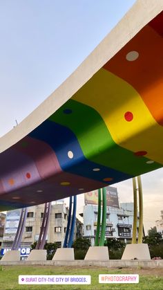 a large colorful structure in the middle of a park