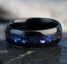 Discover celestial beauty with our Nebula Inspired Tungsten Carbide and Crushed Sandstone Inlay Wedding Set: 🌌 **Material:** Crafted with precision using durable Tungsten Carbide and a mesmerizing Crushed Sandstone Nebula Inlay. 🌈 **Color:** Elegant Black Tungsten with a Nebula-inspired inlay that shifts between captivating blue and purple hues. 🌟 **Comfort Fit:** Designed for everyday comfort, ensuring a perfect fit for both His (8mm) and Her (4mm) bands. 🌠 **Inspired by Orion Nebula:** Thi Traditional Wedding Bands, Rings Aesthetic, Couples Ring, Ring Matching, Orion Nebula, Tungsten Wedding Band, Clothing Aesthetic, Black Tungsten, Tungsten Wedding Bands