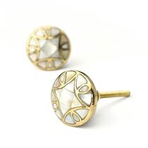 two pairs of gold tone studs with an intricate design