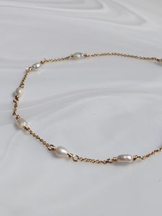 Freshwater Pearl Anklet in Gold Fill.  Use the code ANKLET15 at check out to get 15% off anklets when buying 2 or more. Choice of lengths available so please make sure your choose your correct size, if you require smaller or larger to what is shown please drop me a message as these are made to order, so I can make them to any size . Please note the pearls are on the small size. As they are handmade please note pieces will never have the same finish as machine made/mass produced.  Each one is unique. What is Gold Fill  - Gold Filled Jewellery is a thick layer of Real solid 14k Gold bonded over a base Metal of sterling silver or brass.  - Gold Fill will not tarnish and will never reveal the base layer - it is hypoallergenic  - if looked after well Gold Fill jewellery pieces can last a life t Beautiful Anklet, Pearl Anklet, Gold Bond, Brass Gold, Anklet Jewelry, Body Jewellery, Gold Filled Jewelry, Base Layer, Base Metal