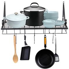 pots and pans are hanging on the rack