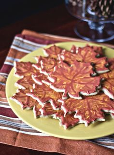 a yellow plate topped with cookies on top of a table