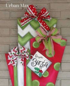 a christmas present hanging on a brick wall