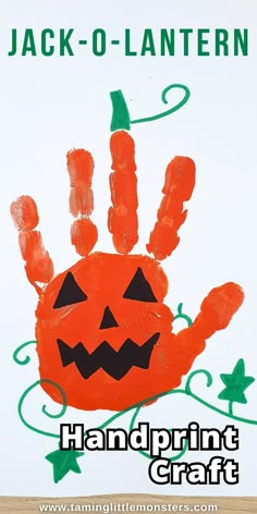 a handprint pumpkin is on the front of a white sign that says jack - o - lantern