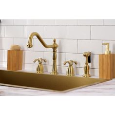 gold faucet sink with soap dispenser and toothbrush holder