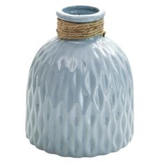 a blue vase with a rope wrapped around it's top and bottom, on a white background