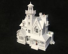 a model of a white house on a black background