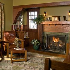 a living room filled with furniture and a fire place in the middle of a room