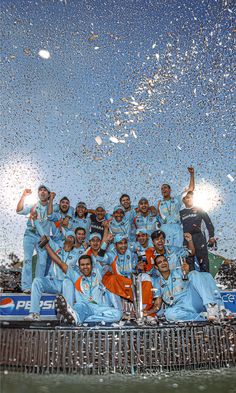 a group of men standing next to each other under a blue sky