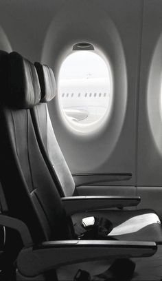 an airplane window with the seat facing out