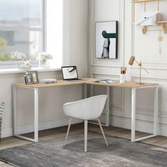 a white chair sitting in front of a wooden desk