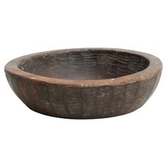 an old wooden bowl is shown on a white background with no people in the photo