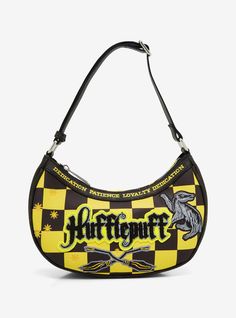 Carry your essentials in Harry Potter fashion with this Fred Segal bag! Featuring a checkered background the front of this bag includes sherpa "Hufflepuff" lettering with embroidered brooms stars and a badger mascot. With an attached shoulder strap this purse also includes a removable crossbody strap and "Dedication Patience and Loyalty" lettering along the trim to bring a touch of magic to any look. Hufflepuff Things, Harry Potter Bag, Black Soil, Checkered Background, Hufflepuff House, Harry Potter Cosplay, Harry Potter Style, Harry Potter Shirts, Fred Segal