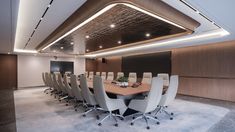 an empty conference room with white chairs and a wooden table in front of a black screen