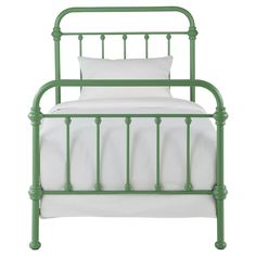 a green metal bed with white sheets and pillows