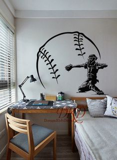 a bedroom with a baseball wall decal on the wall