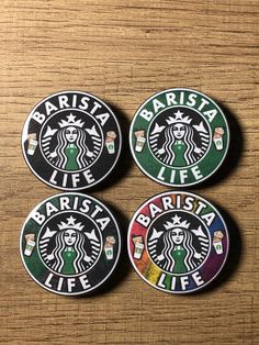 three starbucks coasters with the words barista life on them sitting on a table