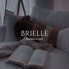 a woman laying on top of a bed next to an open book with the words briel