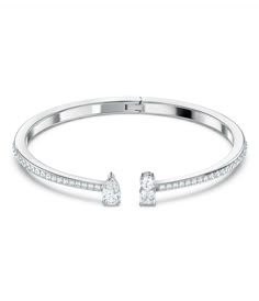 From Swarovski, this bracelet features:Cuff BraceletAttract CollectionRhodium PlatedMetal / Crystal Hinge closureApprox. 2.25 x 1.875Imported.