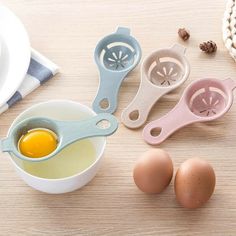 an egg slicer and other kitchen utensils on a table