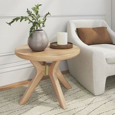 a living room with a chair, table and potted plant on the coffee table