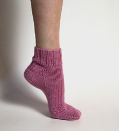 a woman's legs wearing pink socks