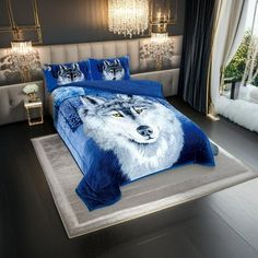 a bed room with a neatly made bed and a wolf comforter on the floor