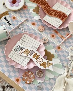 a close up of a birthday card on a table with buttons and other things around it