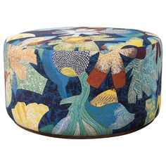 a blue ottoman with colorful designs on it