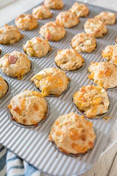 muffins are sitting on a baking tray ready to be baked