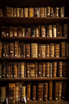 an old book shelf filled with lots of books