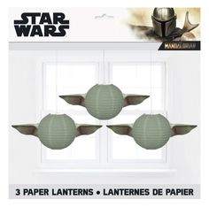 star wars paper lanterns with yoda's helmet on them in front of a window