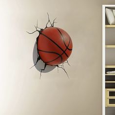 a basketball is breaking through the wall with it's back and front end exposed