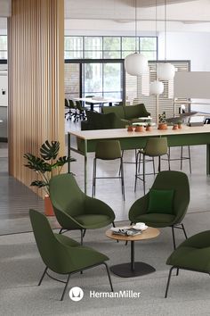 an office with green chairs and tables in it