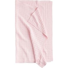 a pink blanket folded on top of a white background