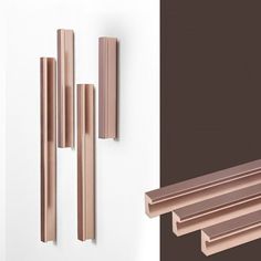 three different types of wood and metal on the same wall, one is brown and white