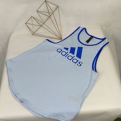 Women's Blue Adidas Tank Top. Light Blue With Cobalt Blue Graphic And Trim. Underarm To Underarm : 17" Shoulder Seam To Hem : 24" Super Soft Fabric- 93% Polyester, 7% Spandex Nwt (#16 Adidas Casual Tank Top For Sports, Casual Blue Tank Top For Sports, Adidas Tops For Gym In Spring, Adidas Blue Sleeveless Top, Adidas Tops For Gym, Spring Season, Spring Adidas Tops For Gym, Adidas Blue Tops For Spring, Spring Adidas Blue Tops, Spring Blue Adidas Tops