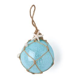 a blue ornament hanging from a rope with a starfish on the top