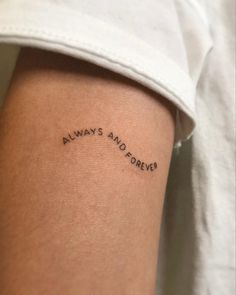 a woman's arm with the words always and forever tattooed on her left arm