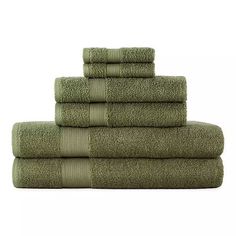 six towels stacked on top of each other in olive green color, with one folded and the