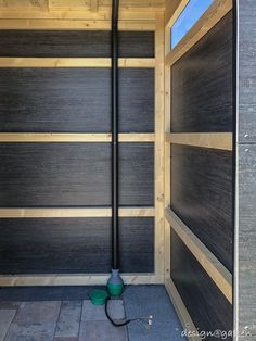 the inside of a wooden building with a green fire hydrant