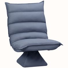 an upholstered chair with a pillow on it's back and foot rest