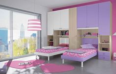 a bedroom with pink and purple furniture in it