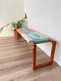 two wooden benches sitting next to each other on top of a hard wood floored floor