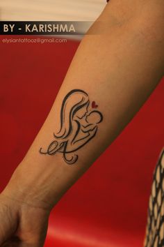 a woman's arm with a tattoo on it that reads, by - karshmaa