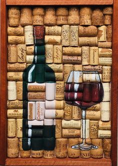 a wine bottle and two glasses on a cork board