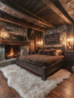 a rustic bedroom with stone fireplace and wood flooring is pictured in this image from the front